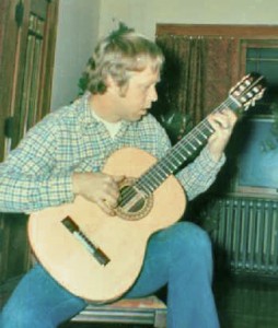 Portrait of the luthier as a young man, playing guitar #1...uh, trying to.